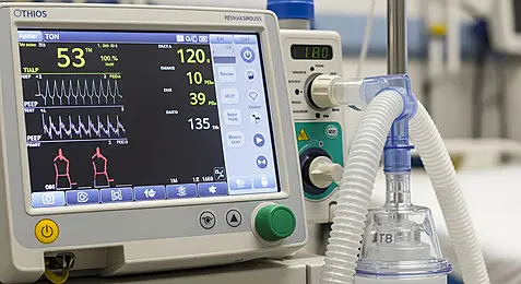 Oxygen concentrator device close up showing flow settings and oxygen output