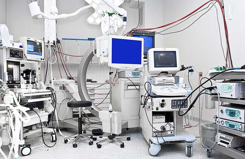 Technician servicing hospital equipment