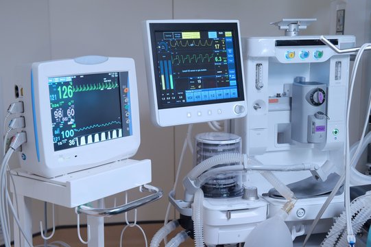 Biomedical engineer checking equipment